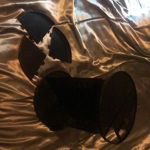 A makeup/nail product wheel on a spinning platform includes 3pc shelf attachment